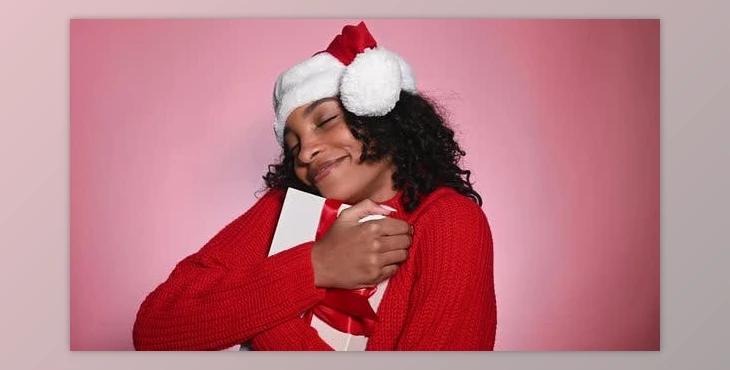 Download Happy Woman in Santa Hat Holding Present Merry Christmas Concept (Videohive 47712440)