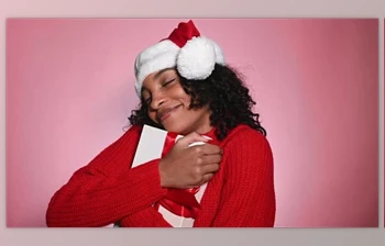 Download Happy Woman in Santa Hat Holding Present Merry Christmas <span class='badge badge-warning'>Concept</span> (Videohive 47712440)